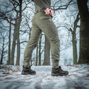 M-TAC Military style Aggressor tactical combat pants in olive green with reinforced knees and cargo pockets outdoor winter setting