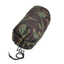 Waterproof military camo compression storage bag with drawstring closure for camping and outdoor gear protection.