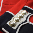 Close-up of genuine British army red scarlet jacket cuff with golden cavalry buttons and white trimming detail