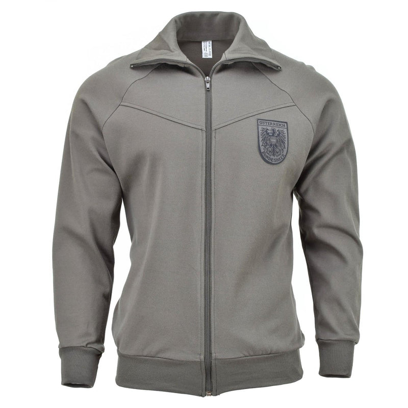 Genuine Austrian Army grey sports jacket with full zip and military insignia patch on chest, vintage style track jacket.