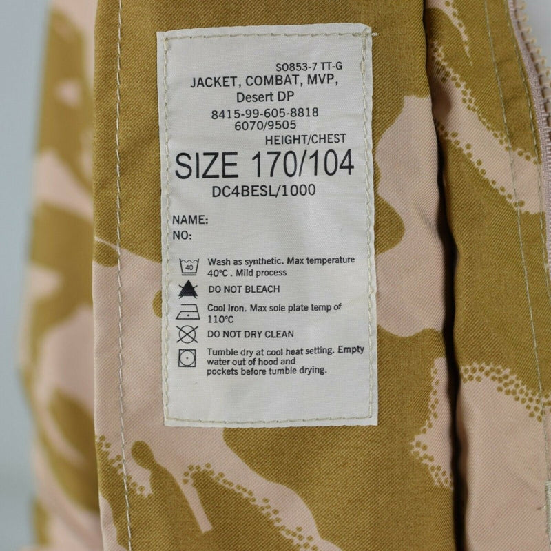 Close-up of British Army desert camo MVP combat jacket label with size and washing instructions on fabric