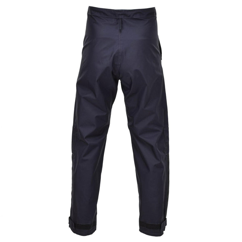 Genuine British police waterproof rain trousers in blue, designed for wet weather and outdoor use.