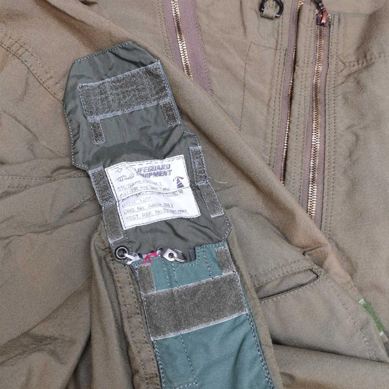 Close-up of genuine British Royal Air Forces coverall showing zipper, label, and fabric details of military jumpsuit