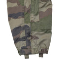 Close-up of genuine French military CCE camouflage coverall pant leg with reinforced stitching and adjustable cuff straps
