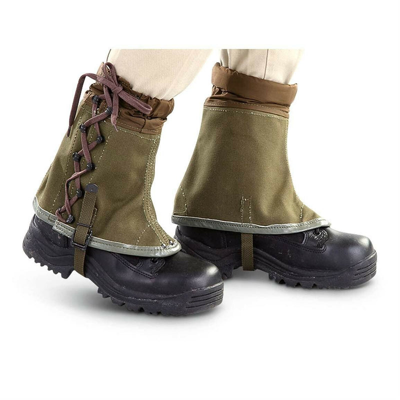 Vintage genuine Italian army olive canvas hiking gaiters with lace-up front and ankle straps on black boots