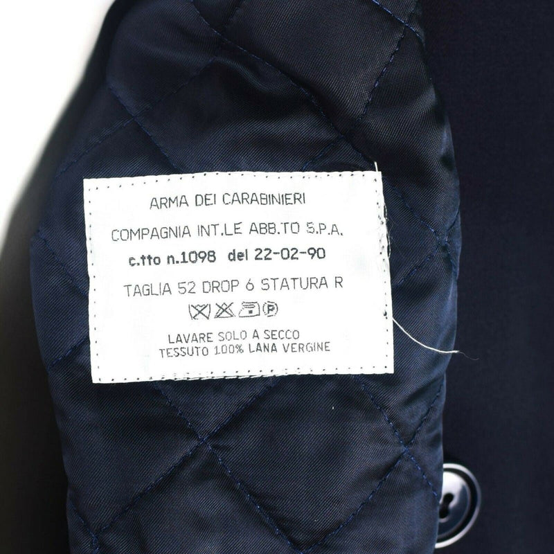Close-up of the label inside a genuine Italian Carabinieri trench coat showing fabric and care details.
