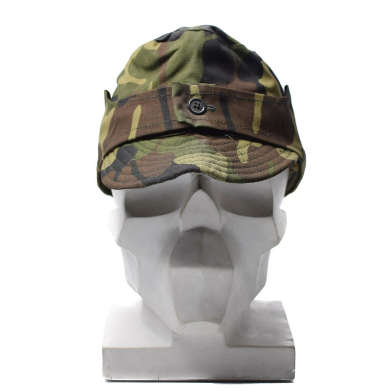Original Romanian M93 leaf camouflage field cap with adjustable neck flap on white mannequin head