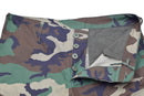 Close-up of Mil-Tec U.S. Military style woodland camo ripstop BDU cargo pants with button fly open.