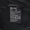 Close-up of MIL-TEC fleece jacket label showing size medium, 100% polyester bonded fleece with TPU membrane and care instructions.