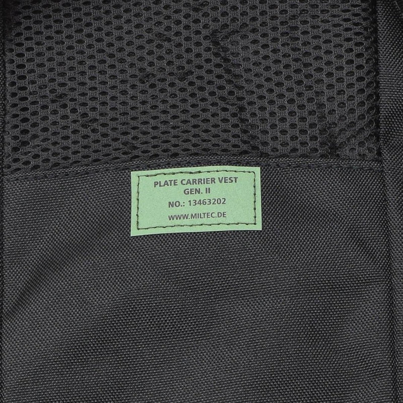 Close-up of a black MIL-TEC Gen II military plate carrier vest label with mesh and durable fabric details.