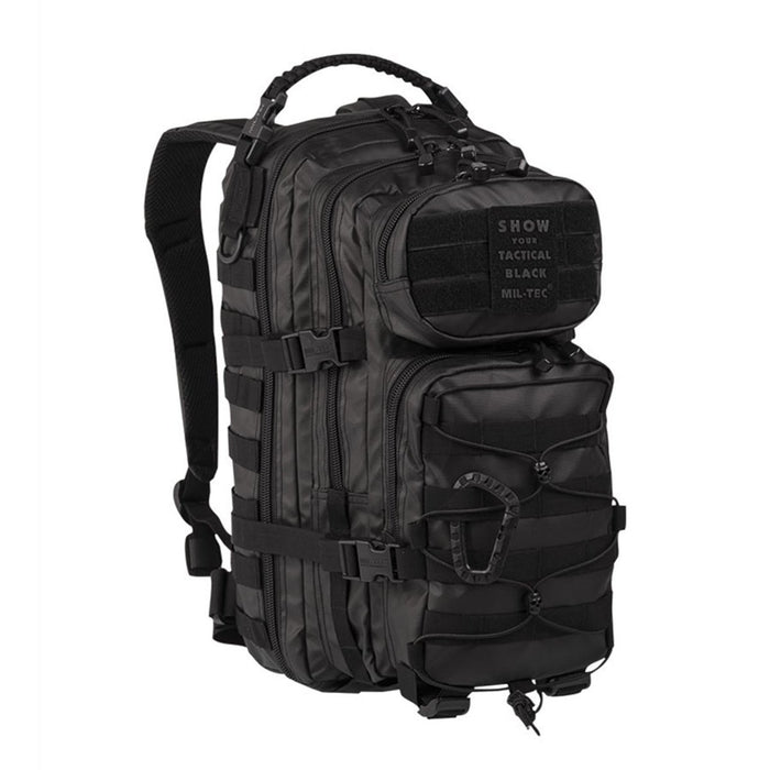 Sac à dos tactique noir MIL-TEC U.S. Assault 20L avec plusieurs compartiments et bretelles rembourrées réglables pour la randonnée et le camping.