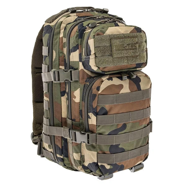 MIL-TEC U.S. Assault tactical backpack 20 liters in woodland camouflage with MOLLE system and padded straps for hiking and trekking