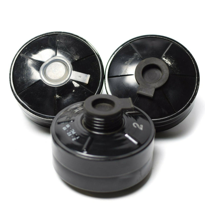 Three black 40mm CF F3 cartridge canister gasmask filters with threaded openings for respiratory protection.