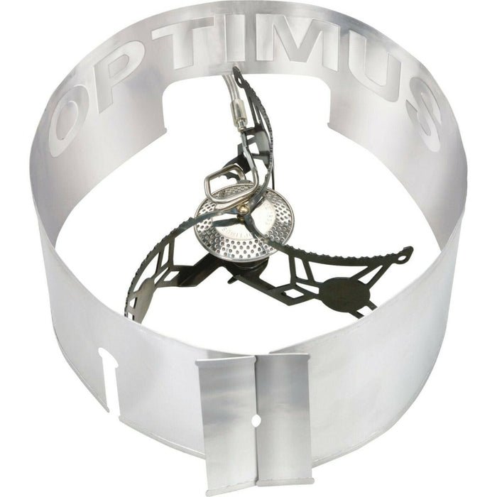 Réchaud de camping pliable léger Optimus Vega avec pare-brise intégré pour une cuisine portable en plein air.