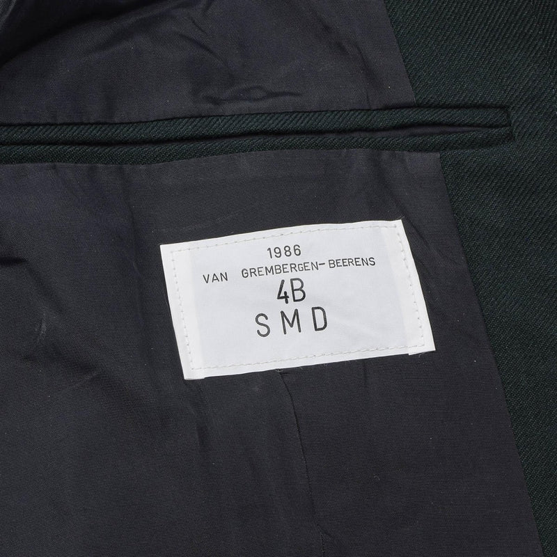 Close-up of the 1986 manufacturing label inside the Original Belgian Army green wool blouson jacket.