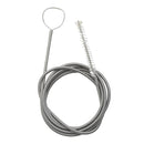 Coiled metal spring with a brush on a white background