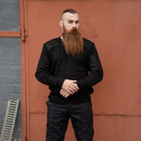 Man wearing black original British army police commando pullover with reinforced elbows and shoulders