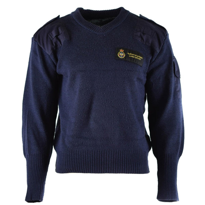 Pull commando en laine bleu col V original du British Defence Service avec épaules renforcées et poche plaquée.