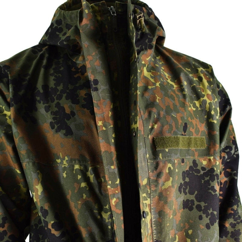 Original German army field jacket in flecktarn camo with GoreTex waterproof, windproof hooded design and adjustable sleeves.