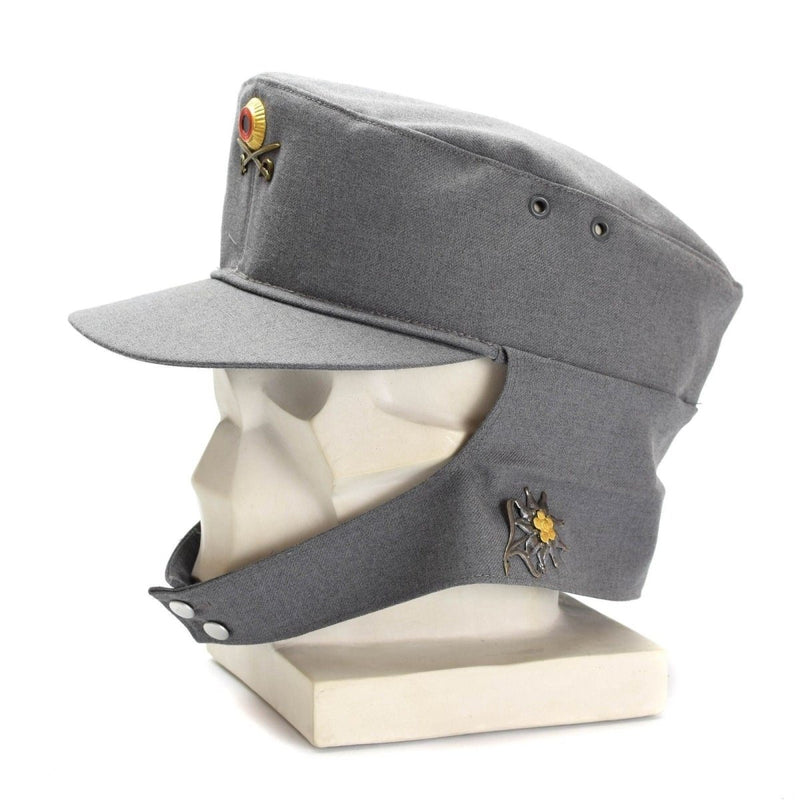 Original German Army Gebirgsjäger mountain cap grey with neck flap and floral badge on display mannequin head