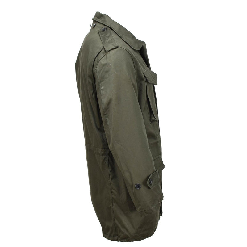 Side view of the Original Greek military M65 olive green field jacket with hood and multiple pockets.