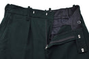 Close-up of original Irish military dark green wool formal trousers with zip fly and button closure.