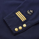 Close-up of navy blue Swedish military dress shirt sleeve with anchor patch, gold stripes, and anchor buttons.