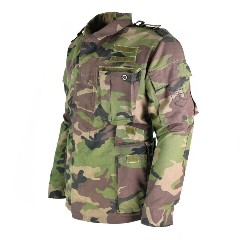 Original vintage Slovakian army M97 field jacket with woodland camouflage, multiple pockets, and military detailing