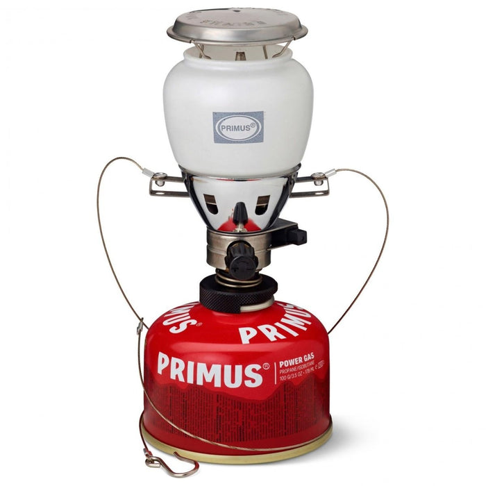 Lanterne à gaz Primus EasyLight Duo avec globe en verre blanc et cartouche de gaz rouge pour l'éclairage du camping et de la randonnée.