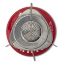 Top view of the compact Primus Essential Trail Stove with a red butane gas canister and metal burner supports