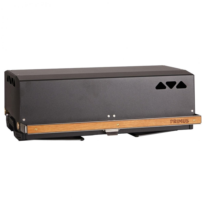 Closed Primus Kuchoma portable lightweight camping grill with wood accent on front panel against white background