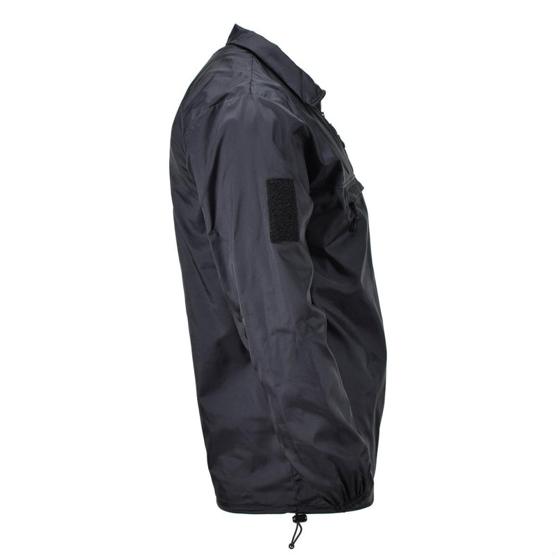 Black TACGEAR windproof lightweight camping and hiking smock with ripstop nylon fabric and adjustable hem cord