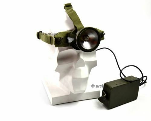 Green headlamp with charging cable on a white background